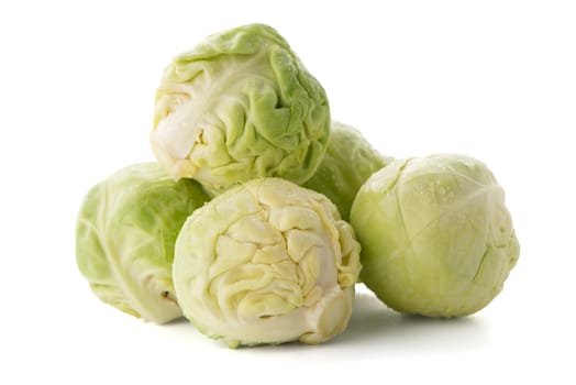 Fresh brussels sprouts isolated on white background.