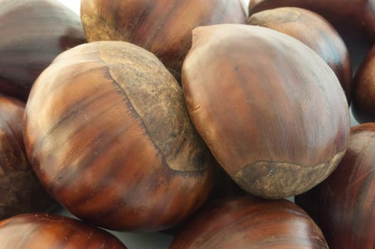 raw natural macro of chestnuts in studio