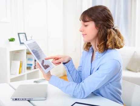 View of a young business woman using a tablet
