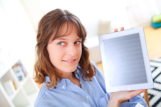 View of a young business woman showing a tablet screen