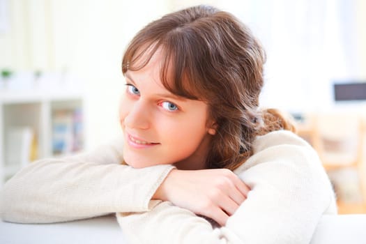 View of a young attractive woman relaxing on sofa