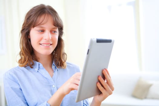 View of a young business woman using a tablet