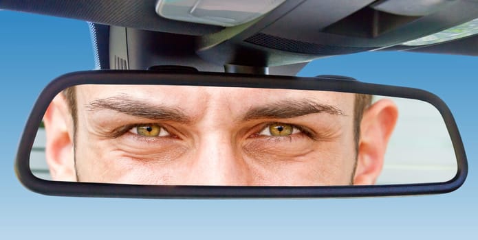 Eyes in the car rearview mirror