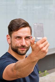 Young man takes a selfie