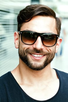 Young attractive man with sunglasses