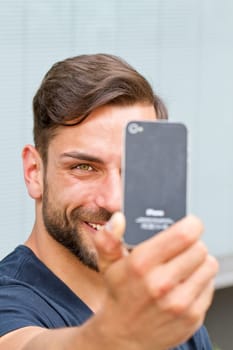 Young man takes a selfie