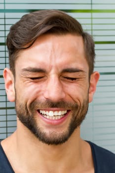 Young man laughing