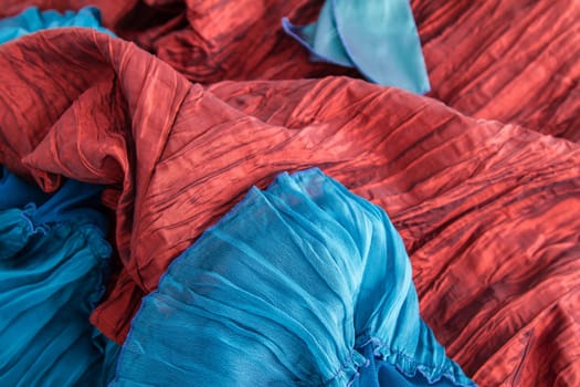 A fancy wrinkled blue and red fabric background.