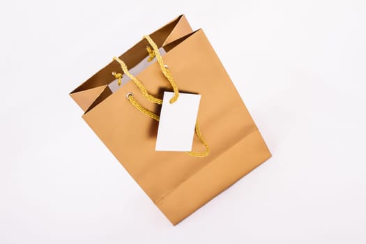 A gold gift bag isolated.