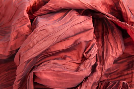 A fancy wrinkled red fabric background.