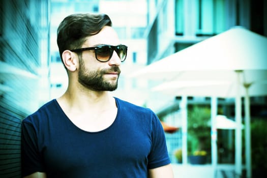 Young man with sunglasses in the city