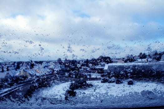 Landscape through a snowy window Wemding, Germany