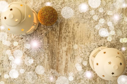 Wooden Christmas background with candle and pine cones..