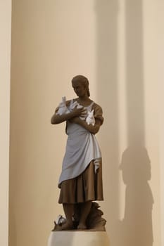 Statue of a girl with a rabbit in the exhibition pavilion building rabbit at ENEA in Moscow