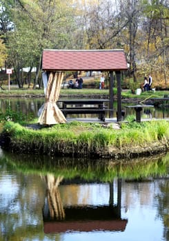 gazebo by the pond in a beautiful park