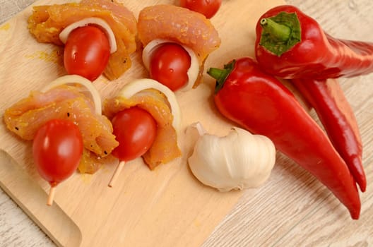 Spicy chicken skewer on a rustic plate