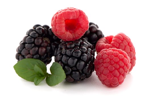 Raspberry with blackberry on white background.