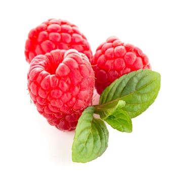 Raspberries with leaves isolated on white background