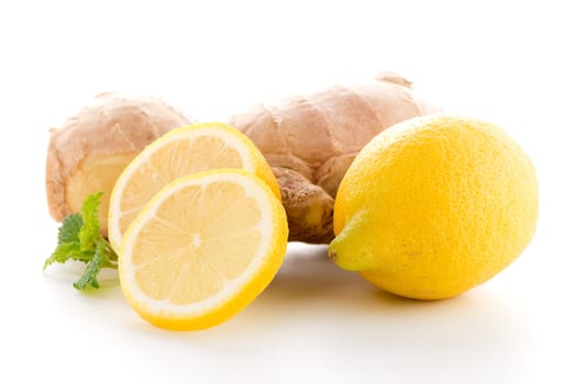 Ginger root and lemon slice isolated on white background.