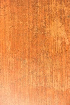 Cracked weathered brown painted wooden board texture.