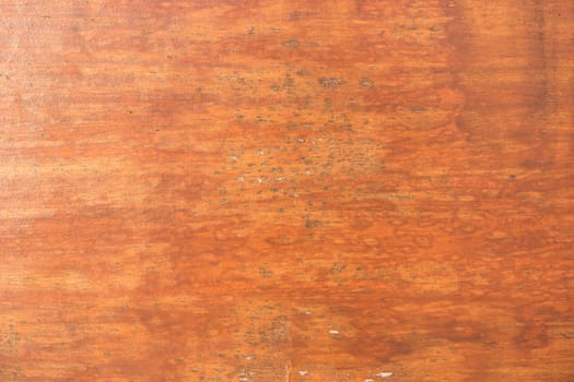 Cracked weathered brown painted wooden board texture.