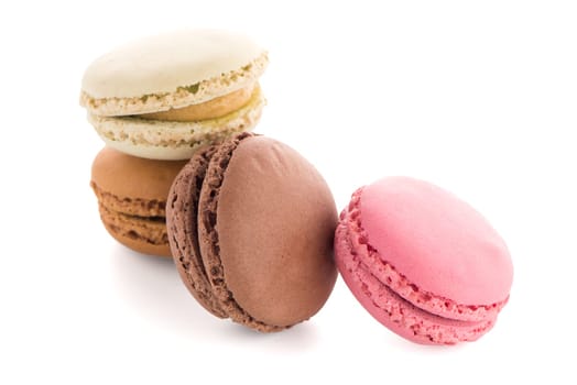 Colorful French Macarons on the white background.