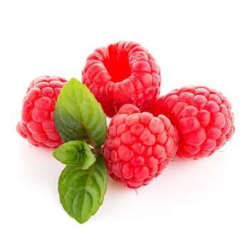 Raspberries with leaves isolated on white background