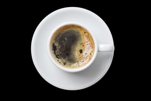 Single cup of coffee top view with plate isolated on empty black background. Clipping path included, so you can easily copy and paste it on your own design.