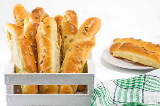 sesame pastry in a white crate