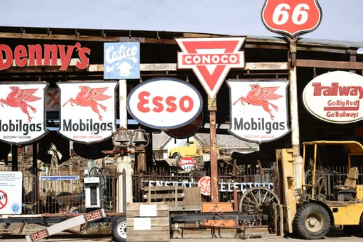 Barstow,United States - December 22,2015: A workshop with a forklift and old vintage and retro signs of various brands on December 22,2015 in Barstow.