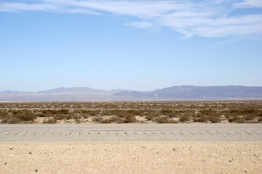 Mountain landscapes and the desert landscape of the Mojave Desert on the way to Mojave city.