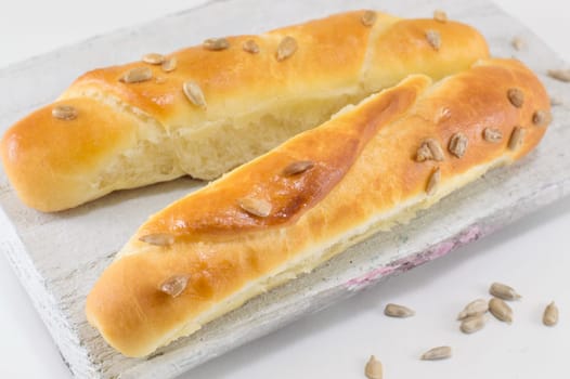 bunch of sesame pastry in a white crate