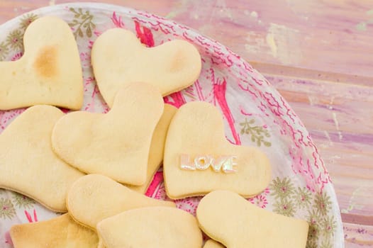 heart shaped biscuits on a decoupage plate