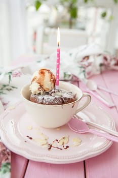 Chocolate cake in cup with vanilla ice cream and almonds