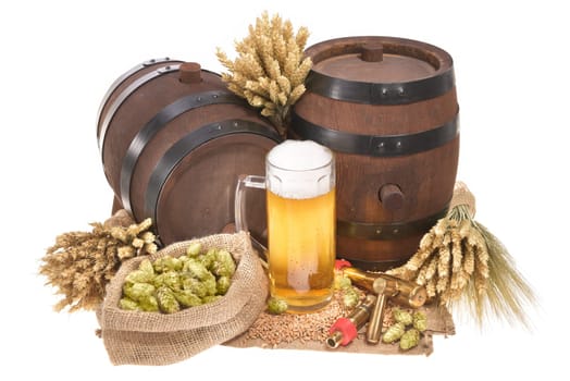 Beer glass and two beer barrels with wheat,barley,hops,malt insulated on white