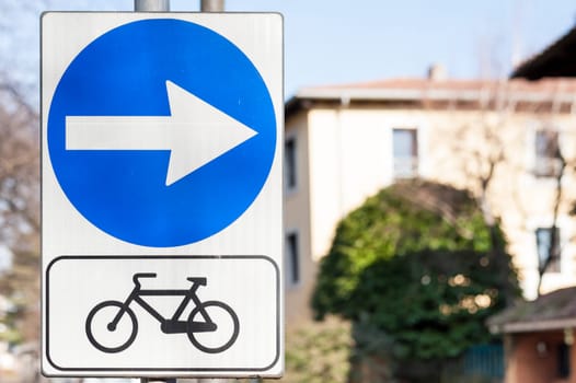 Road sign indicating the direction of the bike path.
