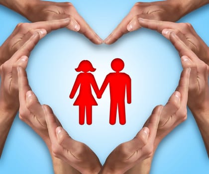Hands make heart shape with a couple in center. Love and protection concept.