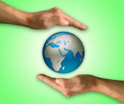 Two hands in position to protect Earth. Protection and conservation concept