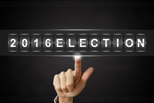 business hand pushing 2016 presidential election on Flipboard Display