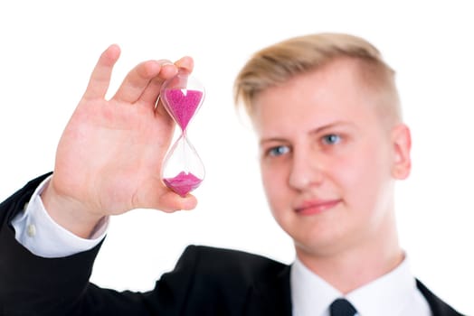 portrait of a young business man in black suit with hourglass