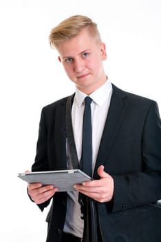 portrait of a young business man in black suit with tablet PC