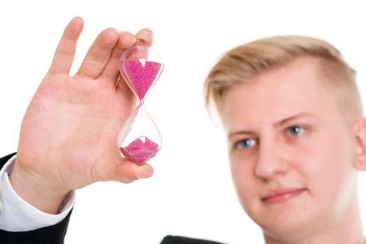 portrait of a young business man in black suit with hourglass