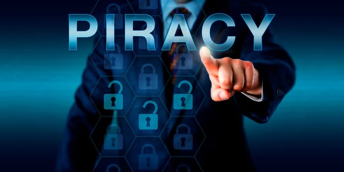 Cyber criminal is pointing at PIRACY on a touch screen interface. Three unlocked padlock icons in a virtual hexagonal protective matrix do represent unauthorized access to compromised online content.