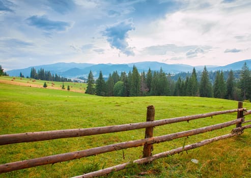 Summer mountain village landscape with blue sky