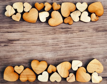 background with wooden  hearts, place for text