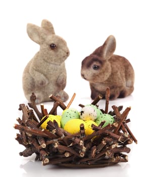Bunnies with Easter eggs isolated on white background