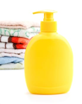 Towels and Soap Dispenser isolated on white