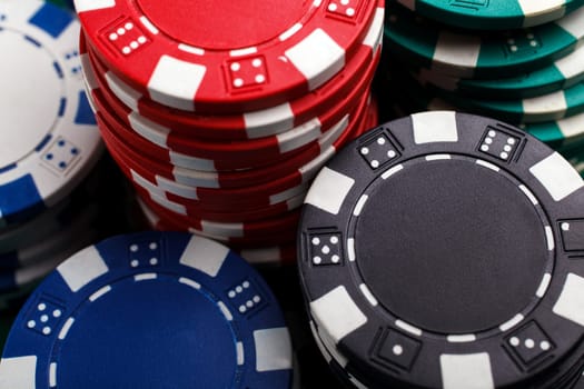 chips for poker on green playing table
