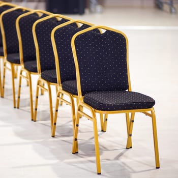 Row of chairs in office meeting room