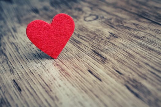 Red heart on the wooden  background, love background
